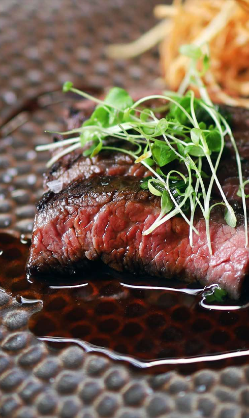 Chef Searing Food at French Restaurant